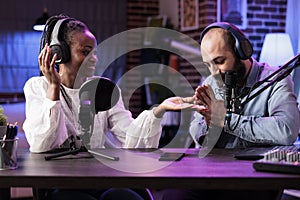 Cohosts presenting entertaining show