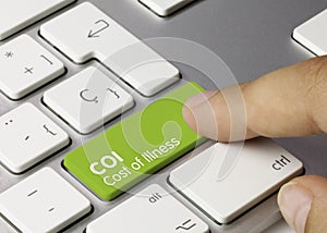 COI Cost of Illness - Inscription on Green Keyboard Key
