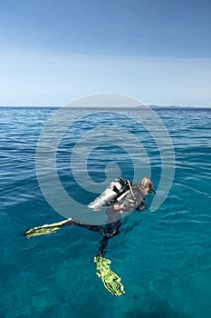 Young woman scuba-diving in Canales de Afuera island area