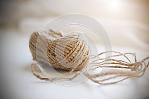 A coil of beige coarse hemp rope