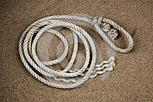 Coil of Old Rope on a Sandy Coastal Beach