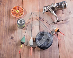 Coil, spools of fishing line, floats and a box of hooks