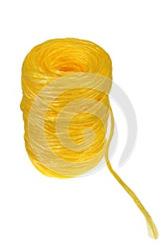 Coil of yellow synthetic rope on white background.