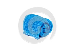A coiled blue sponge made of polypropylene thread on a white background.