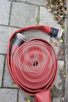 Coiled fire hose on ground during 112 day presentation