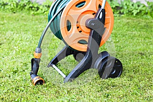 Coiled garden hose on reel