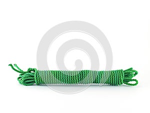 coiled green nylon rope isolated on white background