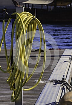 Coiled hosepipe on a jetty