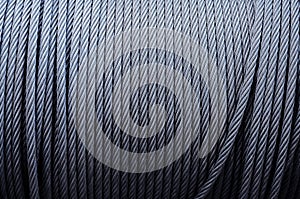 Coiled industrial cabling.Background of galvanized metal cable on the winch