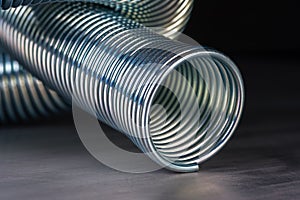 Coiled metal spring on metal surface