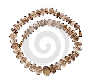 Coiled necklace from faceted Smoky quartz isolated