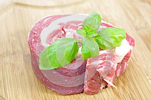 Coiled raw beef with basil