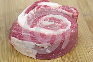 Coiled raw beef
