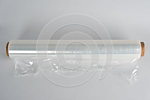 Coiled roll of transparent polyethylene for food packaging