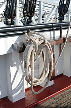 Coiled rope and belaying pin on bulwark