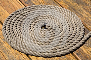 A coiled rope on a pier background