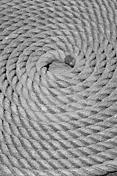 A coiled rope on the pier black and white picture