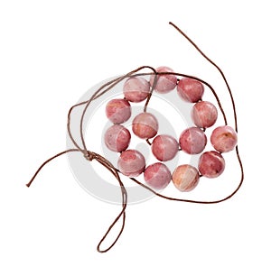 Coiled string of beads from pink rhodonite gems