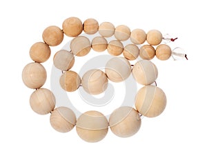 Coiled string of wooden beads isolated