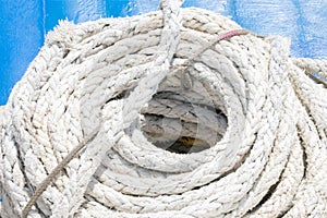 Coiled thick rope on the ship in a spiral