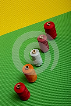 Coils with colored threads on a colored background