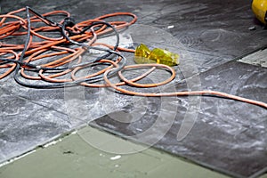 Coils of electrical cable lying on floor workplace photo