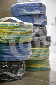 Coils of electrical cable of various colors on the floor photo