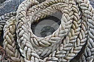 Coils of hemp rope on a beach photo