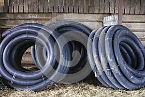 Coils of perforated land drainage pipe