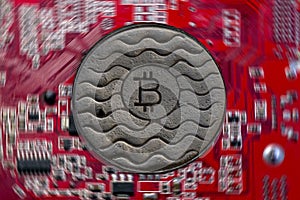 Coin bitcoin is rusty. Against the background of the video card