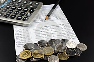 Coin and and calculator on Banking Account for Business Finance