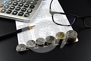 Coin and and calculator on Banking Account for Business Finance Concept