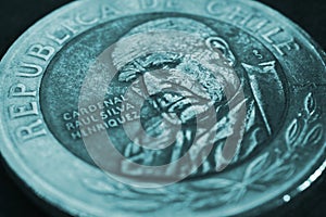 Coin of 500 Chilean pesos closeup. Peso of Chile. News about economy or money. Loan and credit. Interest and inflation. Turquoise photo