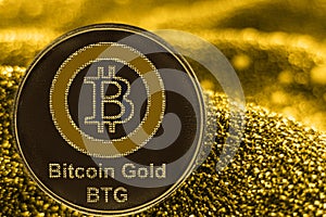 Coin cryptocurrency bitcoin gold BTG token on golden background.