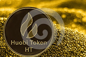 Coin cryptocurrency ht huobi token on golden background. Bitcoincash. photo