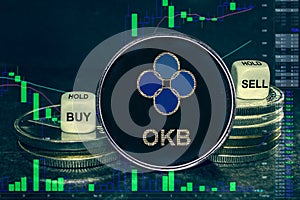 Coin cryptocurrency okb okex  stack of coins and dice. Exchange chart to buy, sell, hold.