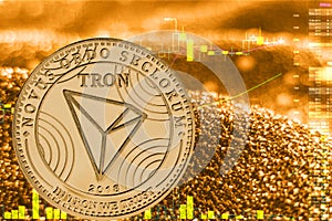 Coin cryptocurrency tron trx on golden chart.