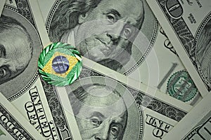 coin with dollar sign with national flag of brazil on the dollar money banknotes background