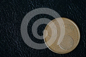 Coin in five euro cents on a dark background