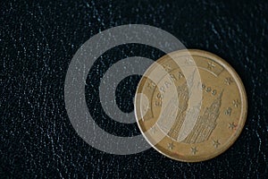 Coin in five euro cents on a dark background