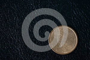 Coin in one euro cent on a dark background