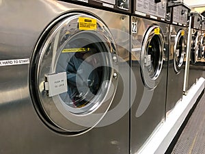 Coin-op Dryers with laundry photo