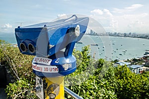 A coin-operated binocular viewer