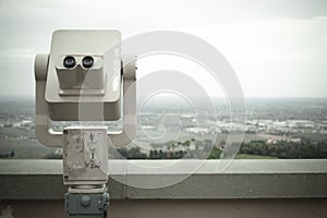 Old telescope with coins