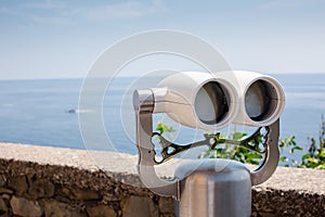 Coin operated binoculars on beach.