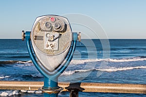 Coin-Operated Binoculars on a Fishing Pier With Ocean Background