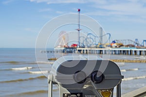 Binoculars overlooking beach in Galveston photo