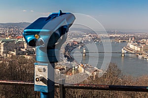 Coin operated public binoculars at Budapest. Blue telescope on observation deck
