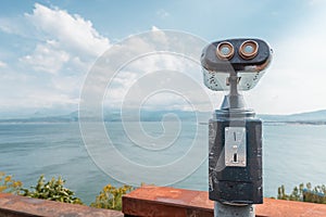 Coinoperated tourist telescope at the viewpoing on a shore of Lake Sevan in Armenia