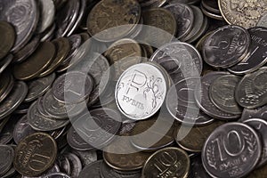 Coin ruble among many other coins